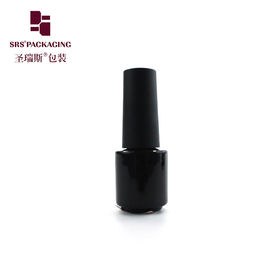Un récipient vide de 3 ml de mini-peinture en verre noir et vernis à ongles.
